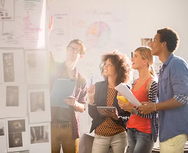 Modern office space with young entrepreneurs collaborating